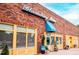 Exterior daytime view of Bloomsbury Bistro featuring a brick facade, blue signage, and yellow trim at 1310 Chamblee Hill Ct, Raleigh, NC 27608