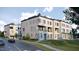 Contemporary townhouse with clean lines, brick facade, balconies, and rooftop greenery at 1310 Chamblee Hill Ct, Raleigh, NC 27608