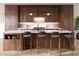 Modern kitchen with dark wood cabinets and sleek countertops at 1310 Chamblee Hill Ct, Raleigh, NC 27608