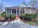 Screened back porch with wooden steps, bushes and sidewalk at 138 Parkdale Ln, Clayton, NC 27520