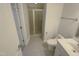 Clean, bright bathroom with glass-enclosed shower and tiled floors offers a modern, functional design at 138 Parkdale Ln, Clayton, NC 27520