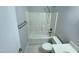 This clean bathroom features a shower-tub combination, white tiling, and a sleek vanity at 138 Parkdale Ln, Clayton, NC 27520