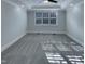 Serene bedroom featuring a large window and plush carpet at 138 Parkdale Ln, Clayton, NC 27520