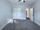 Spacious bedroom offers neutral carpet, a ceiling fan, and ample closet space with double doors at 138 Parkdale Ln, Clayton, NC 27520