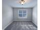 Well-lit bedroom features plush carpeting and a large window at 138 Parkdale Ln, Clayton, NC 27520