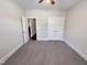 Spacious bedroom offers neutral carpet, a ceiling fan, and ample closet space with double doors at 138 Parkdale Ln, Clayton, NC 27520