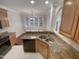 Updated kitchen with a breakfast nook, granite counters and stainless steel appliances at 138 Parkdale Ln, Clayton, NC 27520