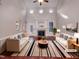 Bright living room with fireplace, ceiling fan, hardwood floors and modern decor at 138 Parkdale Ln, Clayton, NC 27520