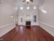 Large living room boasts a fireplace, hardwood floors, and lots of natural light at 138 Parkdale Ln, Clayton, NC 27520
