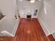 Bright living room with hardwood floors and fireplace, offers a cozy yet elegant gathering space at 138 Parkdale Ln, Clayton, NC 27520