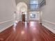 Bright and spacious living room showcasing gleaming hardwood floors and elegant architectural details at 138 Parkdale Ln, Clayton, NC 27520