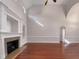 Cozy living room featuring a fireplace, hardwood floors, and large windows for ample natural light at 138 Parkdale Ln, Clayton, NC 27520