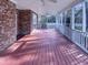 Inviting screened-in porch with red wooden flooring and views of the backyard, perfect for relaxing at 138 Parkdale Ln, Clayton, NC 27520