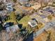 An aerial view of a beautiful neighborhood featuring tree-lined streets, well-maintained homes, and green spaces at 152 E Tryon St, Hillsborough, NC 27278