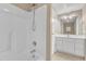 Bathroom featuring a shower/tub combo with a handheld showerhead and a vanity with a mirror at 152 E Tryon St, Hillsborough, NC 27278