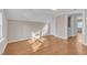 An upstairs bedroom with hardwood floors featuring access to hallway and closet at 152 E Tryon St, Hillsborough, NC 27278