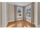 Inviting bedroom featuring two windows with curtains, creating a warm and cozy atmosphere at 152 E Tryon St, Hillsborough, NC 27278