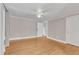 This empty bedroom has nice, wood floors, a ceiling fan and ample space at 152 E Tryon St, Hillsborough, NC 27278
