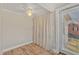 A cozy bedroom has a window and sliding glass door for natural light and ventilation at 152 E Tryon St, Hillsborough, NC 27278