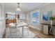 Bright dining area featuring a modern table set and natural light from a window at 152 E Tryon St, Hillsborough, NC 27278