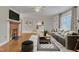 Cozy living room featuring a fireplace, hardwood floors, and stylish decor at 152 E Tryon St, Hillsborough, NC 27278