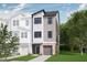 Charming townhome boasts a modern facade with a brick base and a well-manicured lawn at 173 Shakespeare Dr, Homesite 46, Morrisville, NC 27560