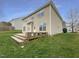 Backyard features a wooden deck and lush grass at 1756 Main Divide Dr, Wake Forest, NC 27587