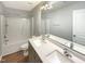 Well-lit bathroom features double sinks and bathtub at 1756 Main Divide Dr, Wake Forest, NC 27587