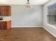 Open dining area features a window and hardwood floors at 1756 Main Divide Dr, Wake Forest, NC 27587