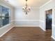 Bright dining room featuring hardwood floors and natural light at 1756 Main Divide Dr, Wake Forest, NC 27587