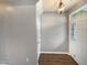 Hallway features a door and hardwood floors at 1756 Main Divide Dr, Wake Forest, NC 27587