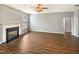 Spacious living room with a fireplace and new laminate flooring, perfect for entertaining at 1756 Main Divide Dr, Wake Forest, NC 27587
