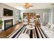 Bright living room featuring a fireplace, stylish furniture, and a zebra striped area rug at 1756 Main Divide Dr, Wake Forest, NC 27587