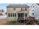 Back exterior featuring a screened in porch and wooden deck at 1800 Bodwin Ln, Apex, NC 27502