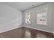 Bright bedroom with hardwood floors and two windows for natural light at 1800 Bodwin Ln, Apex, NC 27502