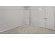 This bedroom offers neutral walls, carpeting, and easy closet access at 1800 Bodwin Ln, Apex, NC 27502