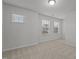 Bright bedroom with two windows offers ample natural light and carpeted flooring at 1800 Bodwin Ln, Apex, NC 27502