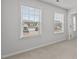 Bedroom features two large windows offering neighborhood views and natural light at 1800 Bodwin Ln, Apex, NC 27502