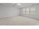 Spacious bedroom features large windows and a trey ceiling adding architectural interest at 1800 Bodwin Ln, Apex, NC 27502