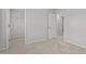 A well-lit bedroom features neutral carpeting and a walk-in closet at 1800 Bodwin Ln, Apex, NC 27502