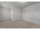 An unfurnished bedroom is shown, offering neutral walls, carpeting, and closet space at 1800 Bodwin Ln, Apex, NC 27502
