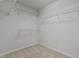 Walk-in closet with wire shelving units offering ample storage space and organization at 1800 Bodwin Ln, Apex, NC 27502