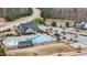 Aerial view showcases a community pool and recreation area within the neighborhood at 1800 Bodwin Ln, Apex, NC 27502