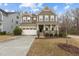 Charming two-story home with a welcoming front porch and attached two car garage at 1800 Bodwin Ln, Apex, NC 27502