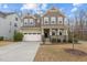 Charming two-story home with a welcoming front porch and attached two car garage at 1800 Bodwin Ln, Apex, NC 27502