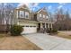 Beautiful front exterior of a two-story home featuring an attached garage at 1800 Bodwin Ln, Apex, NC 27502