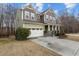 An exterior view of a two story house with a two car garage at 1800 Bodwin Ln, Apex, NC 27502
