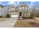 Charming two-story home with a welcoming front porch and attached two car garage at 1800 Bodwin Ln, Apex, NC 27502