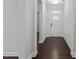 Entryway with hardwood floors leading to a white front door with glass panel at 1800 Bodwin Ln, Apex, NC 27502