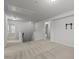 Hallway with neutral carpet, white trim, and multiple doorways leading to other rooms at 1800 Bodwin Ln, Apex, NC 27502